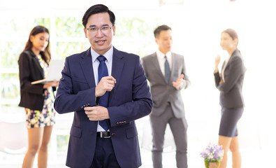 asian businessman with business team