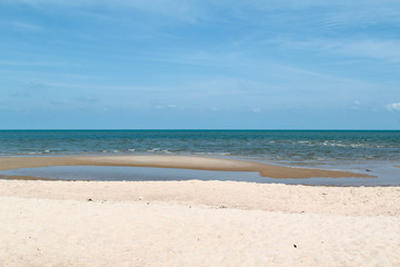 Fototapeta na wymiar Beautiful sand beach with blue sky background.