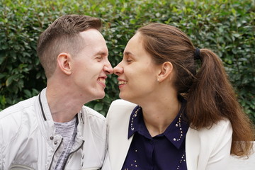 charming good couple husband and wife walking around the city, hugging and spending time with love