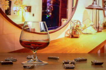 Cognac with chocolate slices