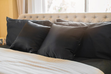 Bed maid-up with clean white pillows and bed sheets in beauty bedroom. Close-up. interior background