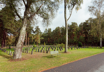 Forest in Skogskyrkogarden with graves and benches for relaxing. UNESCO World Heritage Site in Stockholm, Sweden
