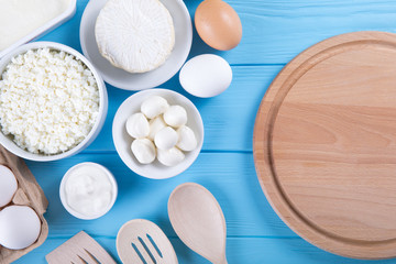  dairy products on blue wooden background