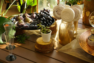 tasty sweet food on the wooden table waiting for the party! nobody.