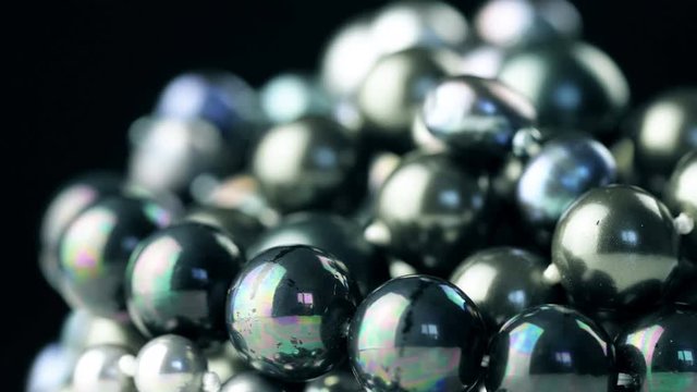 Black pearls rotating close up macro jewellery. 4K footage.