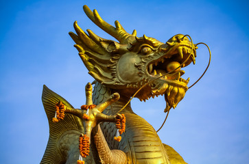 Golden sea dragon statue in Phuket