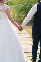 newlyweds hold hands