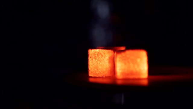 Heating up the coal for hookah on stove