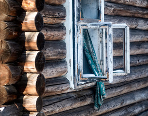 Photo of a burnt house in winter. Charred beams of a wooden house. Burned down house.