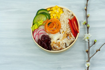 Bowl of vegetables, rice and fish. Healthy food concept.