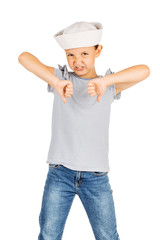 Little girl wearing a sailor costume and looking at the camera on white background.