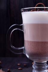 Layered dessert in an Irish glass mug with coffee and chocolate