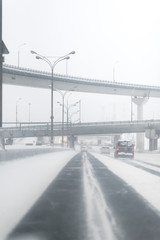 Highway with a lot o snow after a blizzard. dangerous driving. Car on a winter road