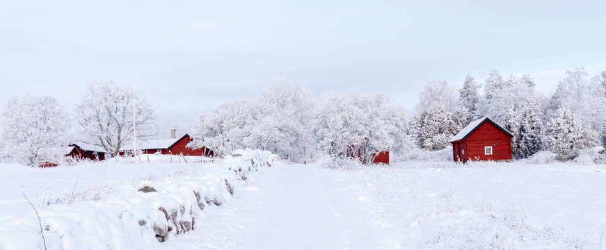 Farm barn and house in a cold winter landscape with snow and frost - Powered by Adobe