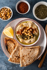 Classic Hummus with chickpeas, paprika, olive oil and oriental spices. Mediterranean popular snack of chickpeas and tahini pasta