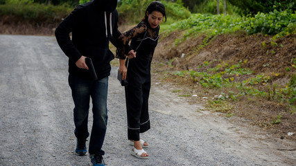 Thief pull female handbag from behind