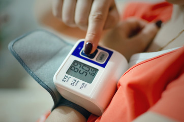 Tonometer on a female hand. Blood pressure measuring concept.