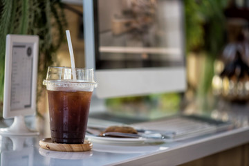 Iced black americano coffee with cookie