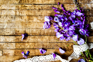 purple acacia flowers on a wooden table
