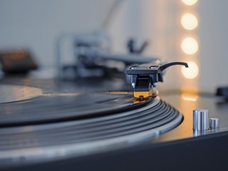 Indoor close-up photography from a record player. - obrazy, fototapety, plakaty