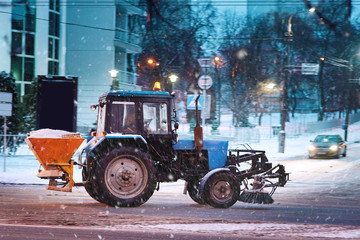 Road maintenance and handling reagents. Using domestic anti glaze reagent - ice melting . Tractor...