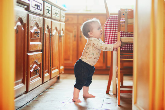 Baby Girl Learning To Stand