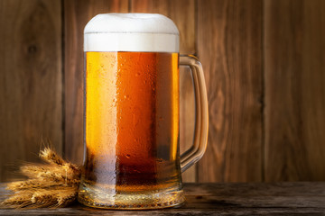 mug of beer on wooden table