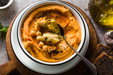 Delicious vegan hummus with sweet potato and canned artichokes. with black sesame. tasty snack of the Middle East