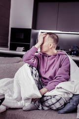 Negative delighted young woman covering her face