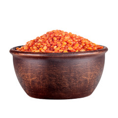red lentil in a clay brown plate isolated on white background