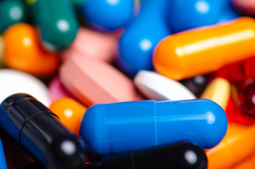 Colorful pills capsule medical medicine pharmacy drug macro blur background