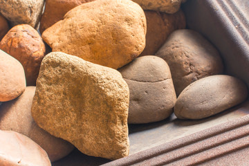 Fototapeta na wymiar Large stones in a stove for a bath