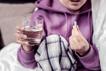 Close up of female hand that holding glass