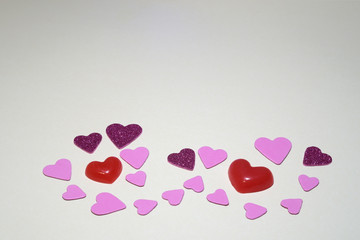 Symbolic image of Valentine's day candles, hearts, pink.