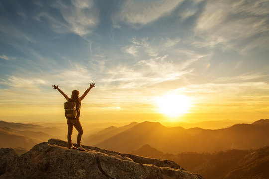 Hiker meets the sunset on the Moro rock in Sequoia national park, California, USA.