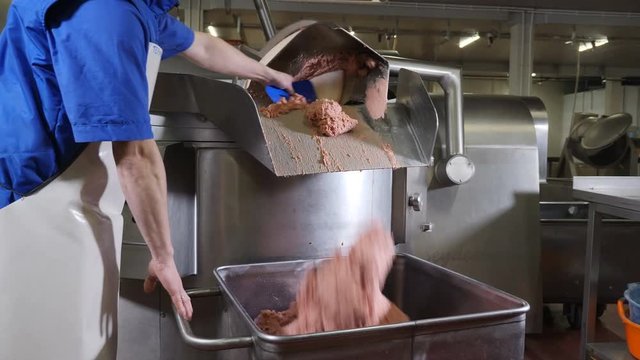 Meat-processing plant. Sausage industry. Final proccess in sausage production. Sausage production line in modern meat factory. Halal Certificate. Food industry. 4k