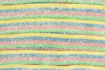 striped gummy candy in blue, green, red and yellow