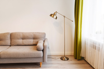 Modern apartment with sofa and a lamp