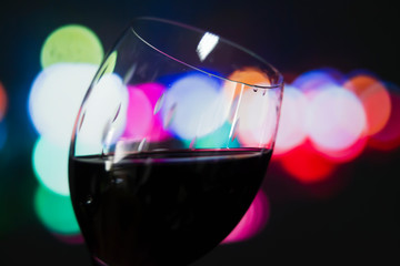 wine glass with lights in the background