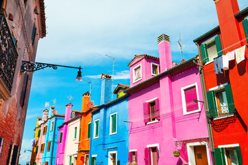 Colorful houses and the blue sky in Burano island, Venice, Italy