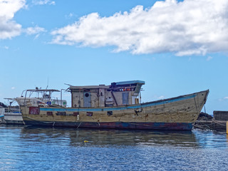 Fototapeta na wymiar Old fishermen boat in Case-Pilote harbor - Martinique, FWI