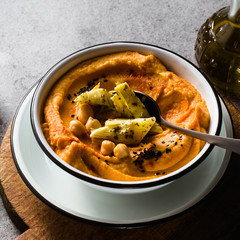 Delicious vegan hummus with sweet potato and canned artichokes. with black sesame. tasty snack of the Middle East