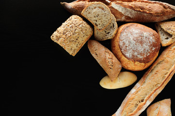 fresh variety bread on black background