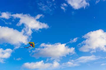 Kite flying in the sky among the clouds