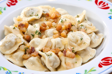 dumplings with potato on the wooden background