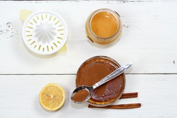 Cellulite treatment from honey, cinnamon and lemon. Ingredients for homemade anti cellulite wrap, flat lay