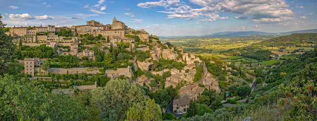 Panorama of Luberon Valley and Gordes at the sunrise. Beautiful scenic view of Gordes, a idyllic hilltop village in Provence, Luberon, Vaucluse, France