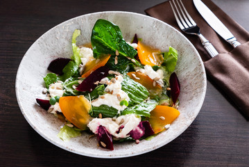 Healthy salad with persimmon