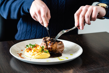 man eating steak