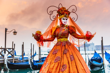 Fototapeta na wymiar Venice, Italy. Carnival of Venice, beautiful mask at St. Mark's Square.